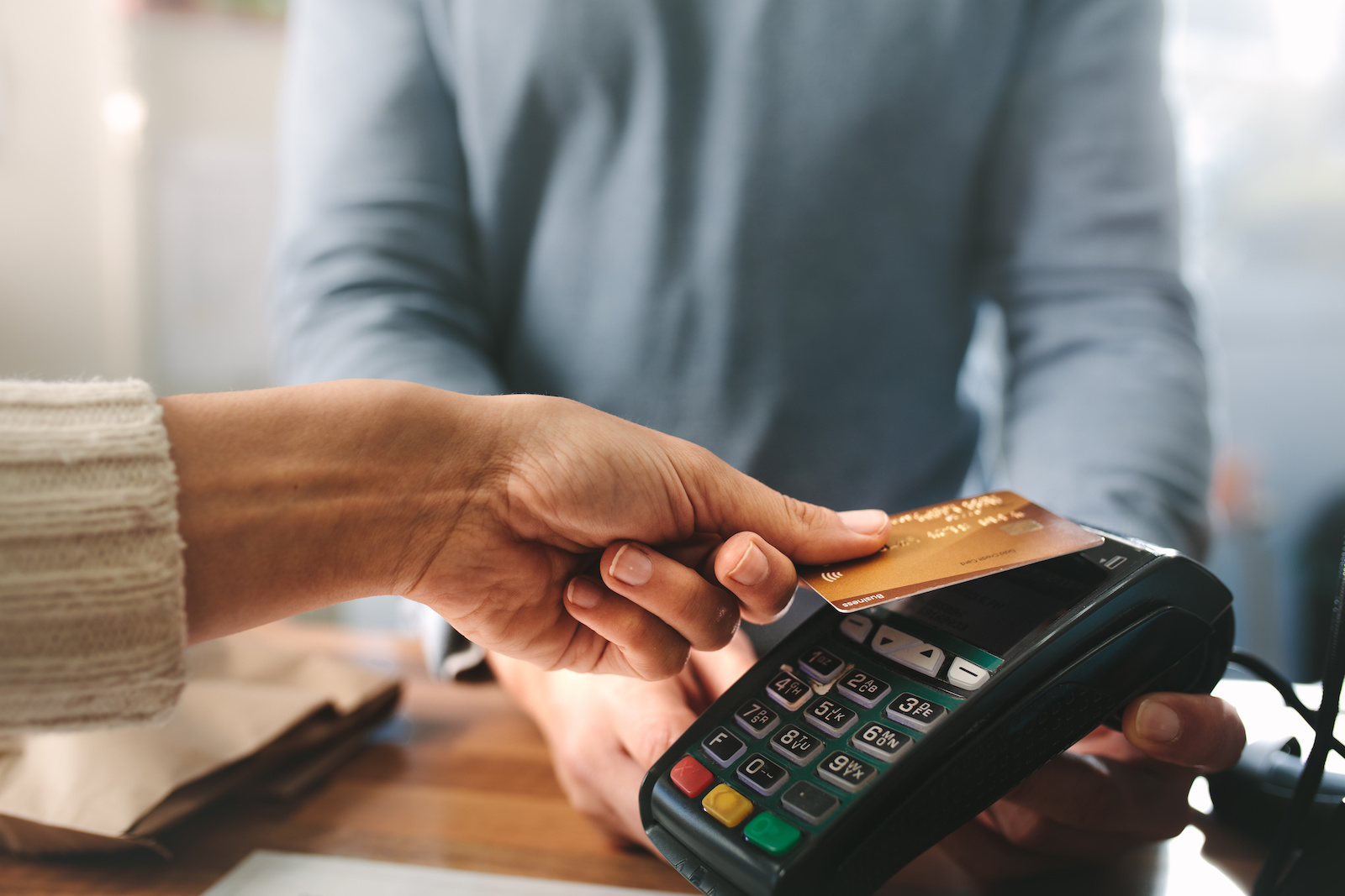 Image of a customer paying using a credit card.