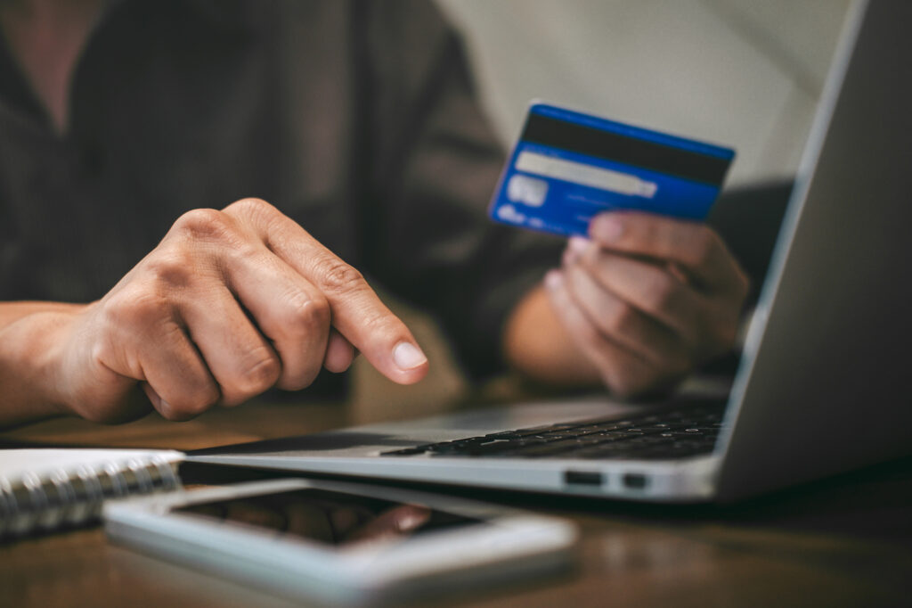 image of someone shopping online with a credit card.