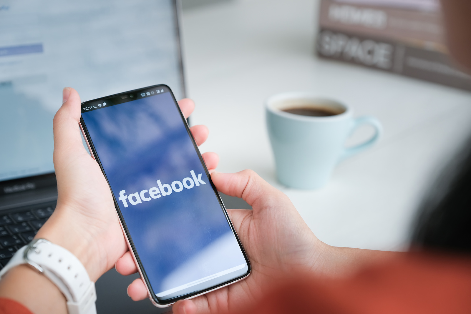 Image of a women using Facebook to shop on her phone.