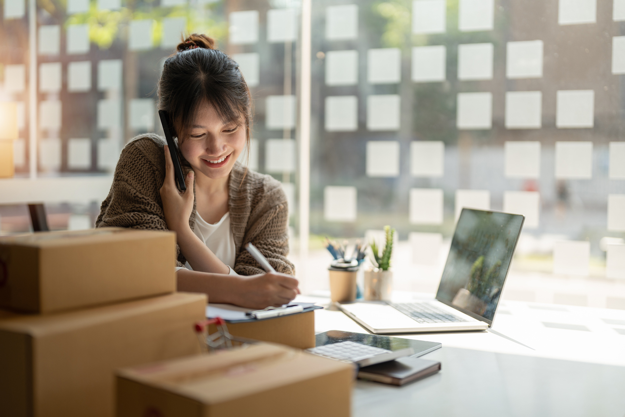 Image of a women with an online business.