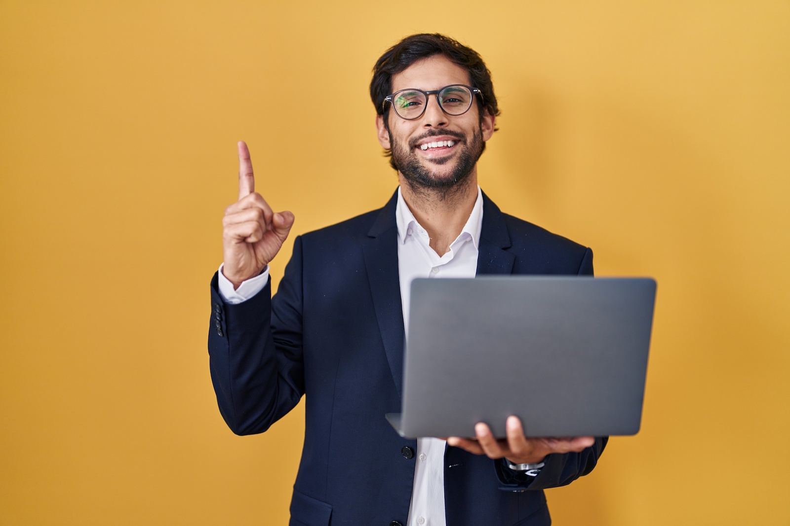 Image of a business owner with a laptop.